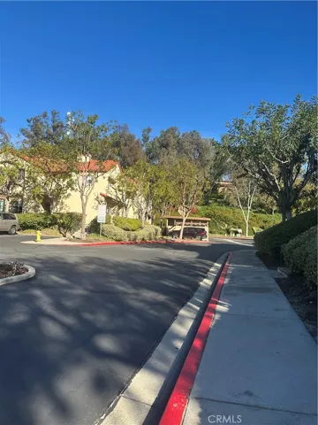 Sidewalk by entrance of parking lot