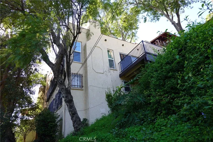 LOOKING UP AT BLDG FROM LOWER WALKWAY