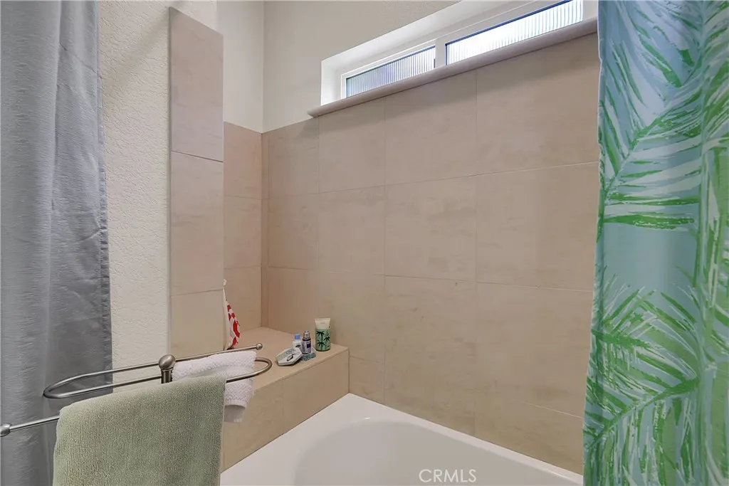 Tiled Guest Bathroom, Tub shower combination.