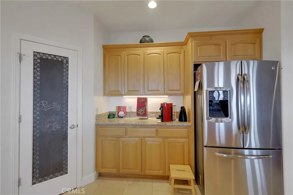 Walk in Butlers pantry and additional counter space with upper and lower cabinets.