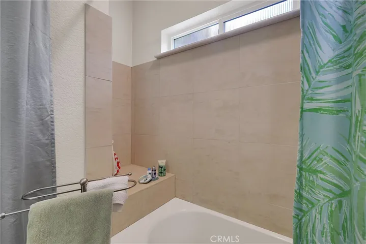 Tiled Guest Bathroom, Tub shower combination.