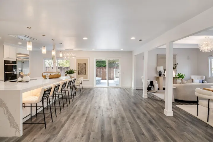 Kitchen leading off to deck area with pool