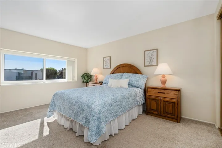 Spacious primary bedroom with plenty of natural light.
