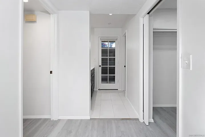 PRIMARY BEDROOM AREA TOWARDS WAK-IN CLOSET & PRIMARY BATHROOM.