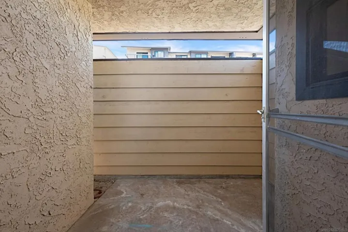 PRIVATE COVERED PATIO WITH ONLY DIRECT ACCESS FROM PRIMARY BEDROOM