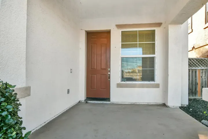 Property entrance featuring stucco siding