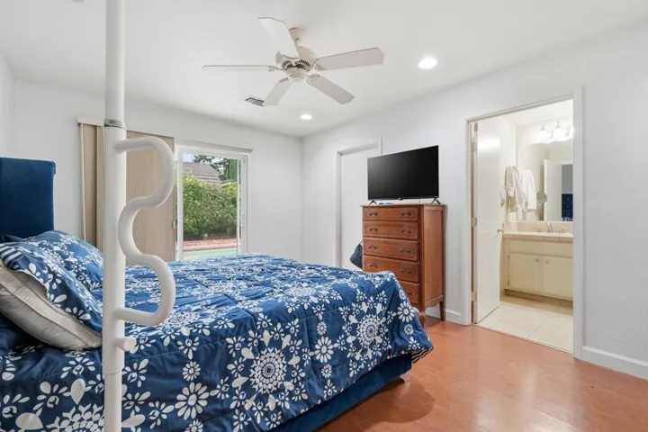 Wood flooring, and direct access to the sparkling pool.