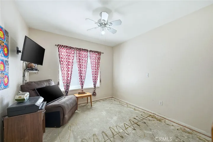 One Downstairs Bedroom - concrete floor