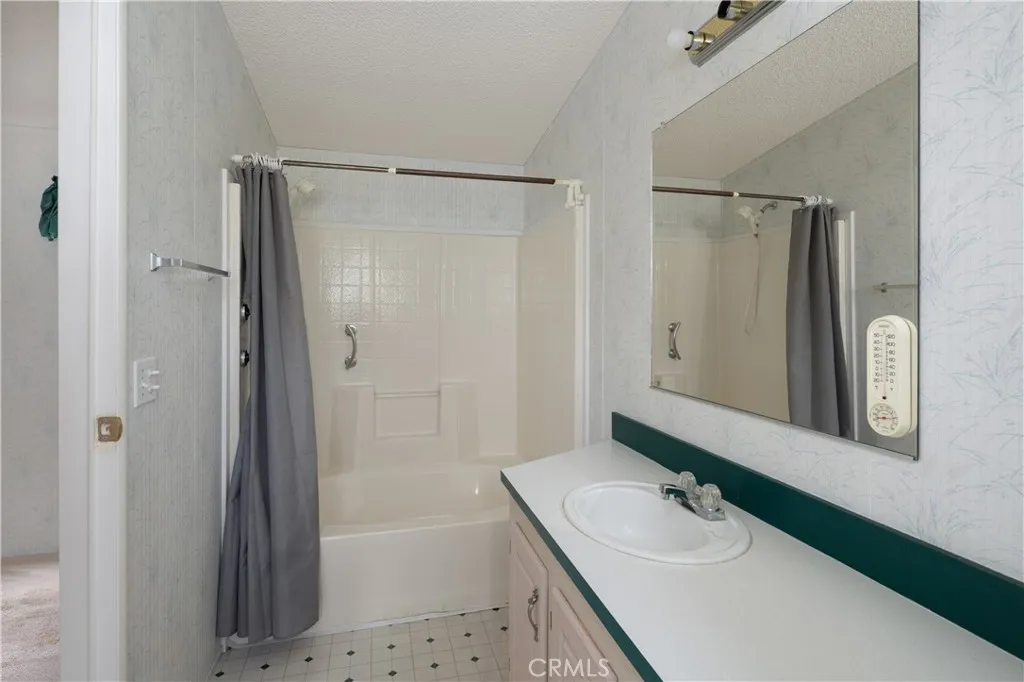 Bathroom in the hallway next to the second bedroom.