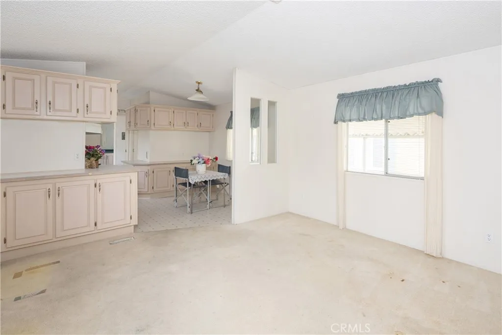 High ceilings and lots of light shine through this unit.