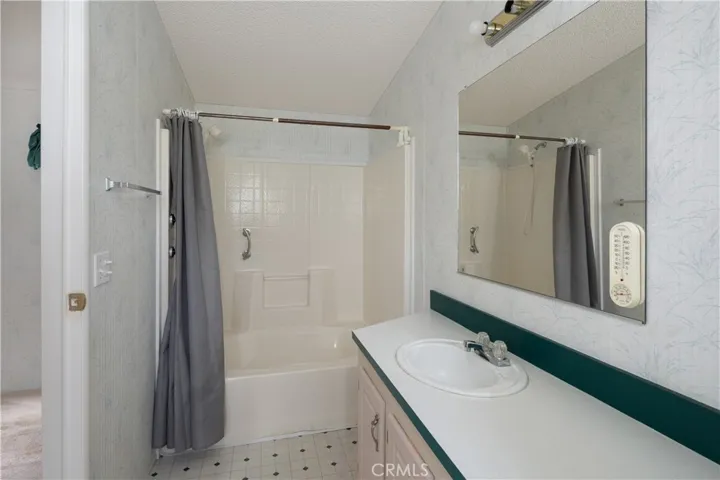 Bathroom in the hallway next to the second bedroom.