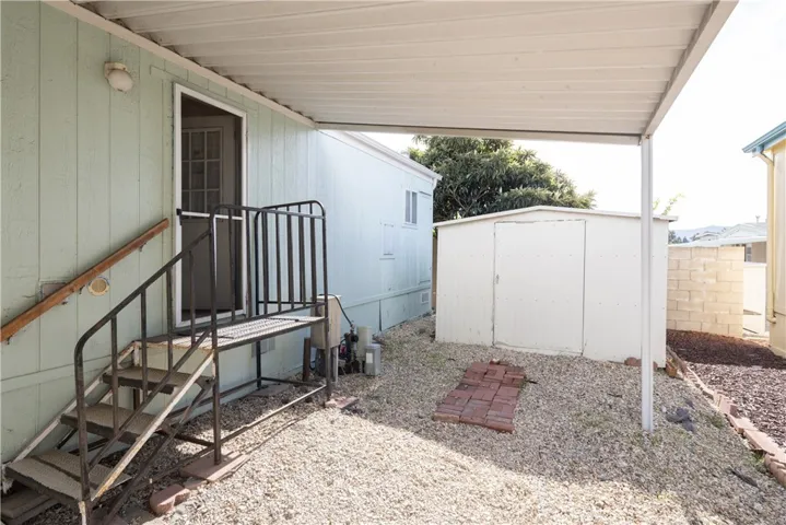 Covered carport with stairs to access your new home.