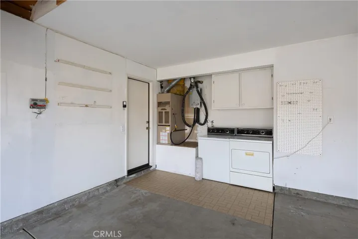 Washer and dryer area in the large two car garage.