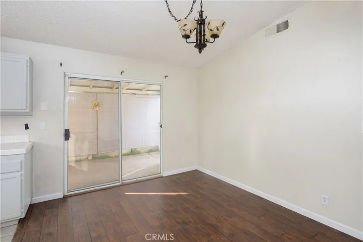 Plenty of space for a kitchen table next to the kitchen cooking area.