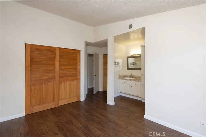 Primary bedroom with the attached bathroom