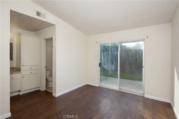 Primary bedroom with an attached bathroom.