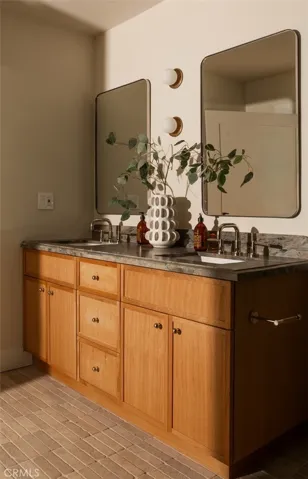 Primary features custom millwork and dual vanity.