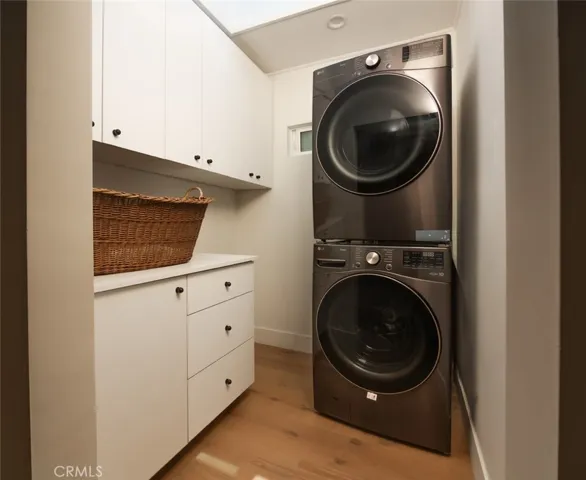 Laundry room with large skylight, conveniently located upstairs.