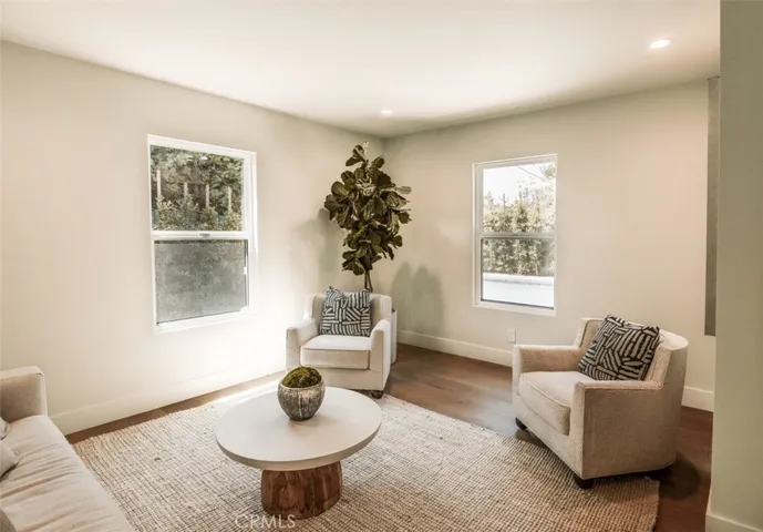 ADU, bedroom 1, staged as a living area.