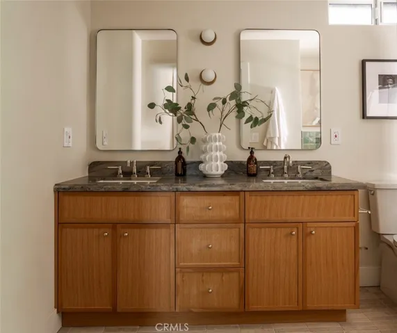 Leathered quartzite countertops with custom accent lighting.