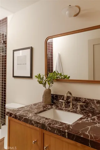 Marble counters with Phylrich faucets.