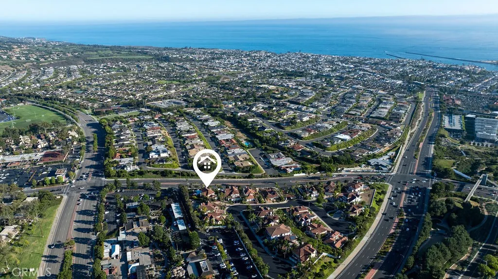 This triangular gated area of Harbor Point has 20 homes with red tile roofs.
