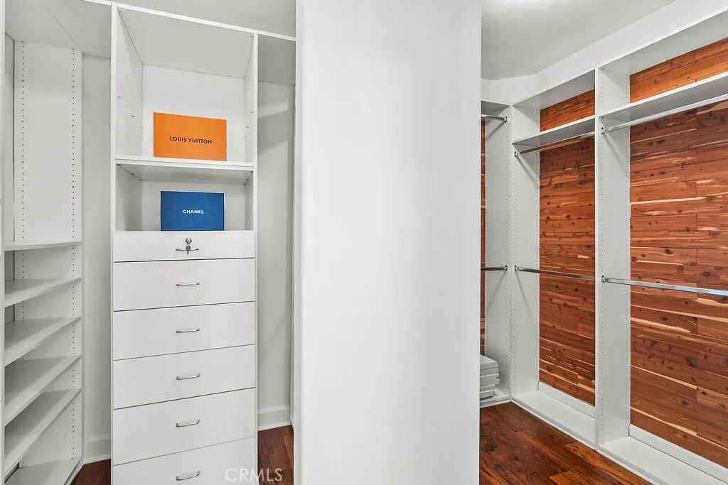 Giant primary closet with some cedar lining.