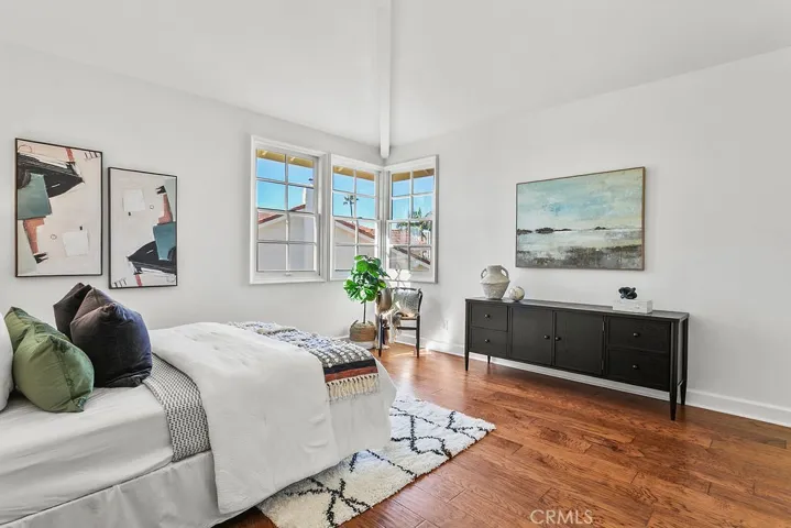 Secondary upstairs bedroom with vaulted ceiling and "peek a boo" view of Newport Center and the ocean.