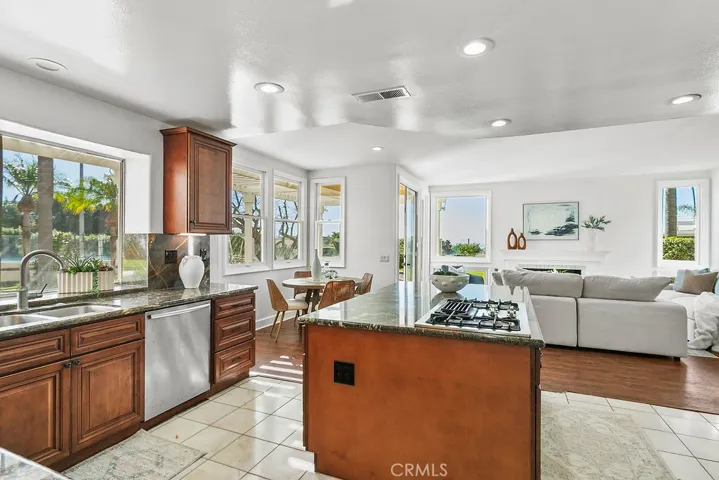 View from kitchen to outdoors and family room.  Note that cooktop is down vented so the openness and view are not obtructed.