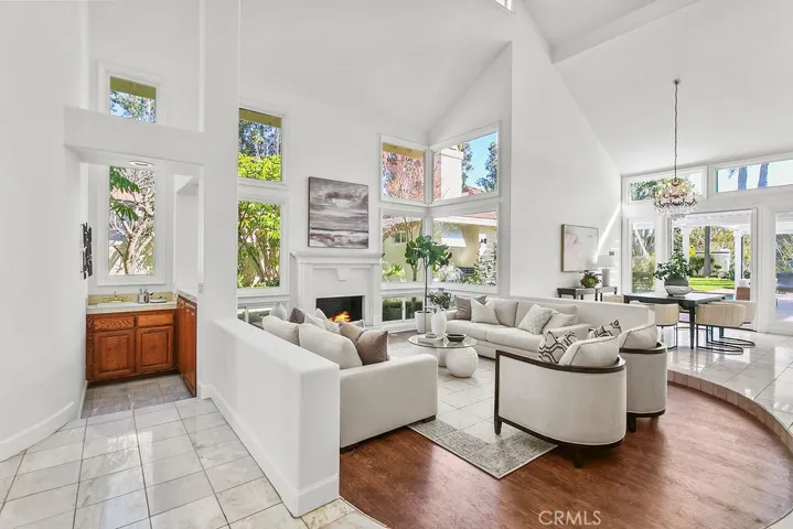 Dining room adjacent to the living room also has high ceilings and opens to the back yard. Fire in fireplace is virtually created.