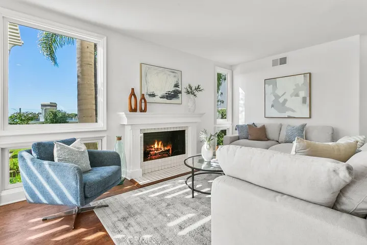 View windows in family room. Fire in fireplace is virtually created.