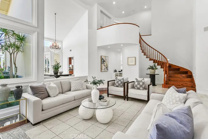 View of curving staircase from Living room.