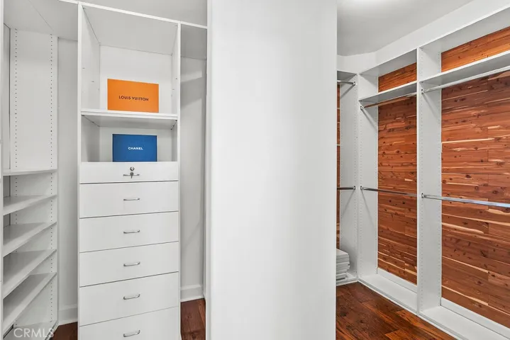 Giant primary closet with some cedar lining.