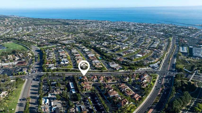 This triangular gated area of Harbor Point has 20 homes with red tile roofs.