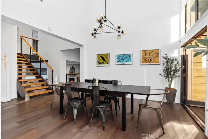 Dining room leads to kitchen, stairs and living room.