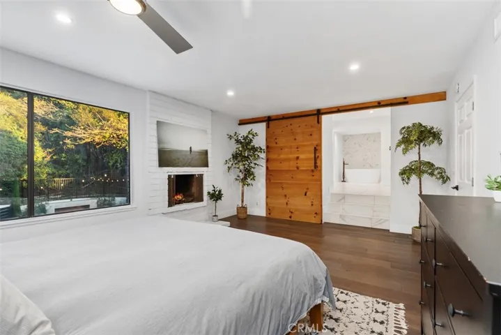 Primary Bedroom with bakyard views looking back at primary suite.