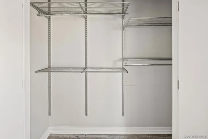 Bedroom closet with shelving from Elfa Container Store