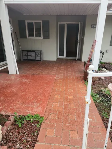 View toward the slider door from courtyard to kitchen direct access