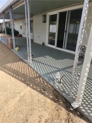 Rear yard wide covered patio