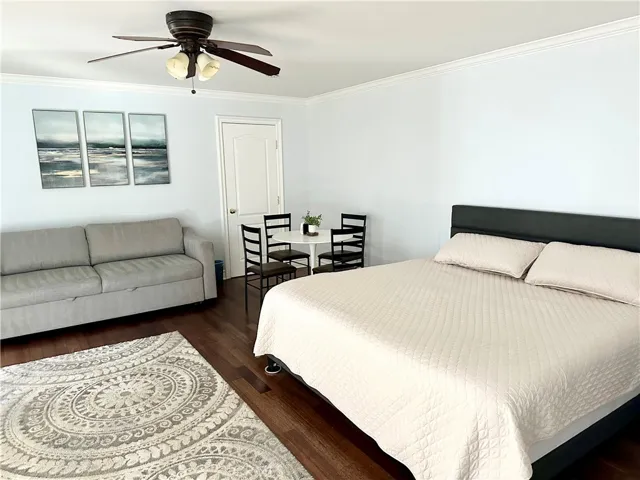 Bedroom with couch and dinner table