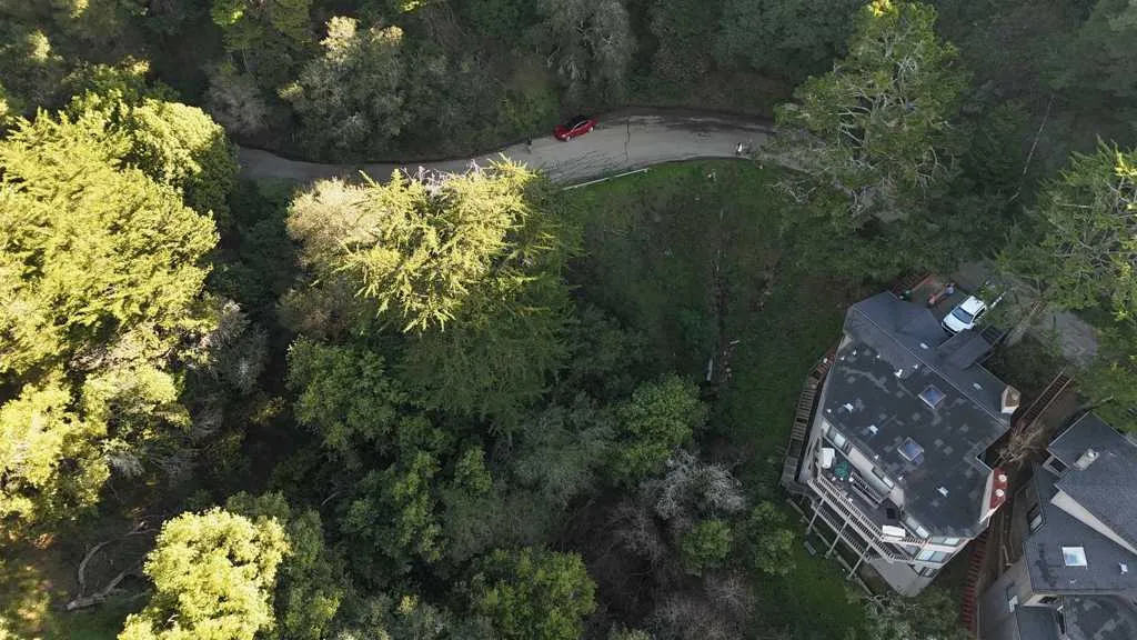 View of property location featuring a heavily wooded area