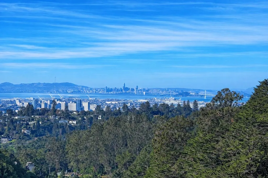 View of mountain background featuring nearby urban area and a nearby body of water
