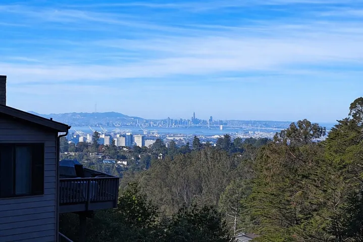 View of mountain background featuring nearby urban area
