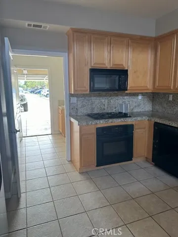 Kitchen opens to laundry room and garage.