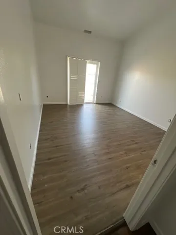 Master bedroom open to back patio.