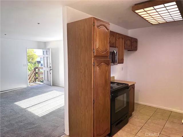 Other side of kitchen backed to livingroom