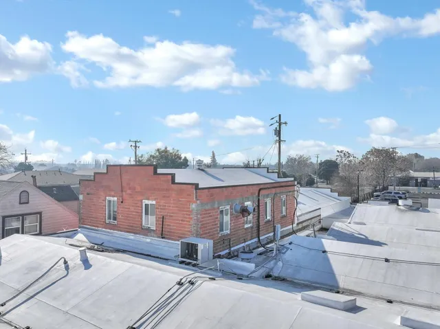 Exterior view of a central AC unit and a satellite dish