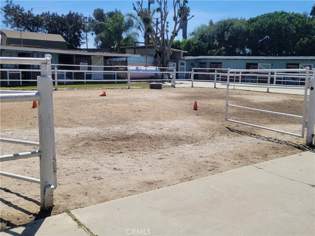 Arena with stables in backgroung