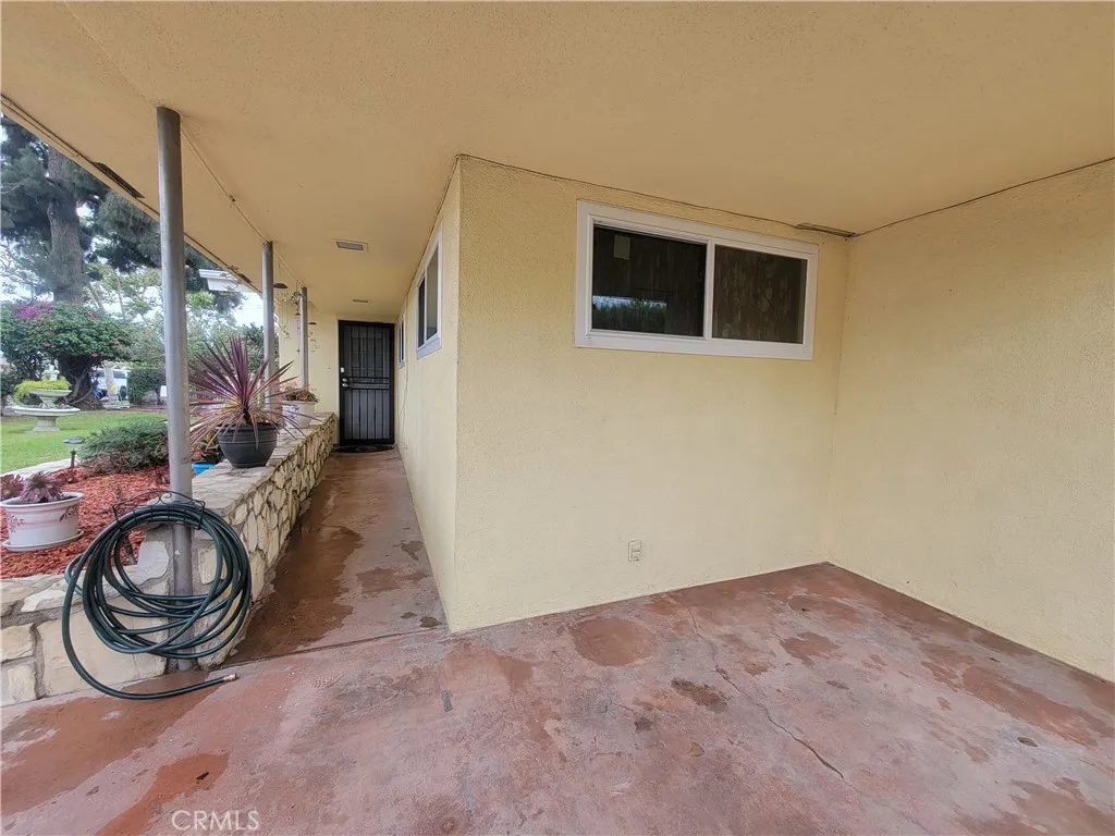 Huge covered porch leads to utility room