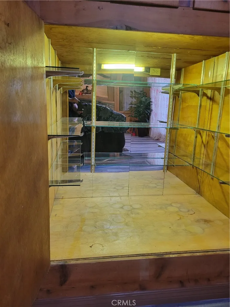 Custom mirrored beverage cabinet is built in.